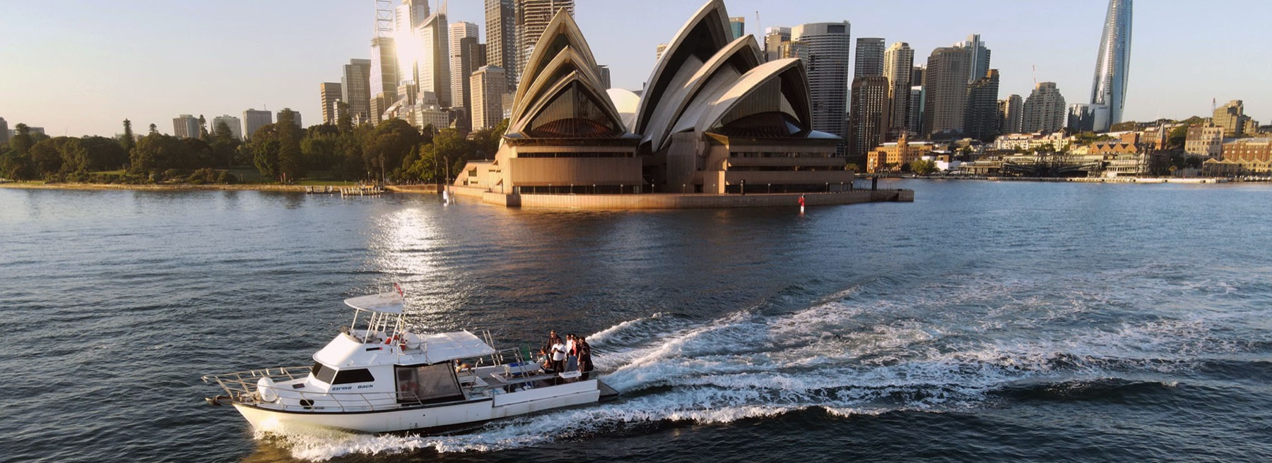 Strike Back running past the Opera House on Sydney Harbour at first light